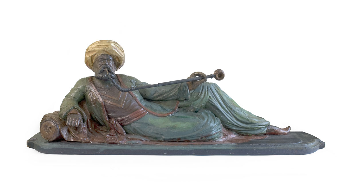 Appraisal: AMERICAN CARVED AND PAINTED TOBACCO STORE COUNTER FIGURE The reclining