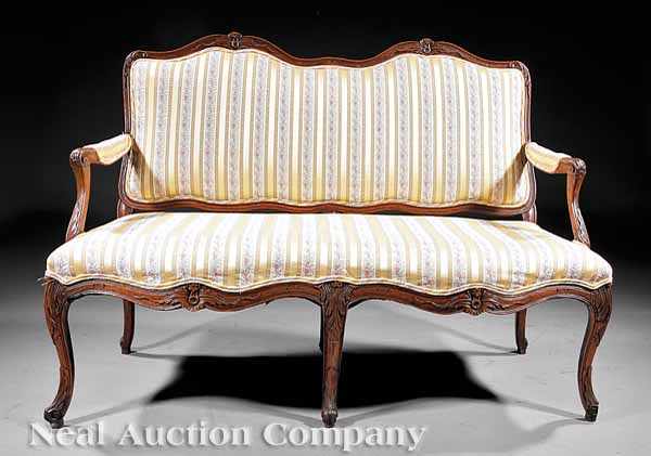 Appraisal: A Pair of Antique Louis XV Carved Fruitwood Canap s