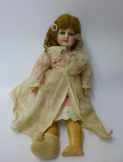 Appraisal: An SFBJ bisque head girl doll with blue glass sleeping