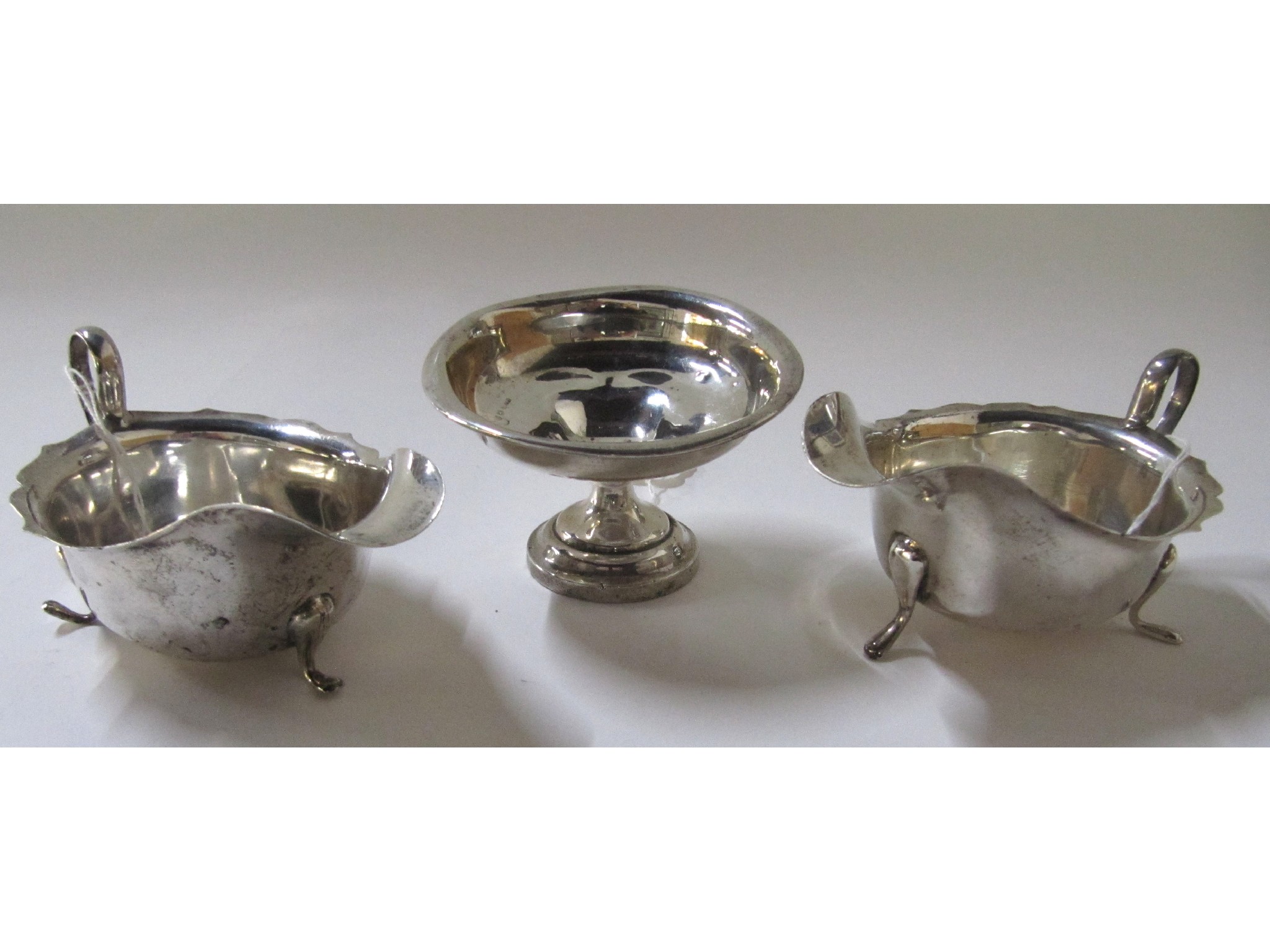 Appraisal: A lot comprising two silver sauceboats and a silver dish