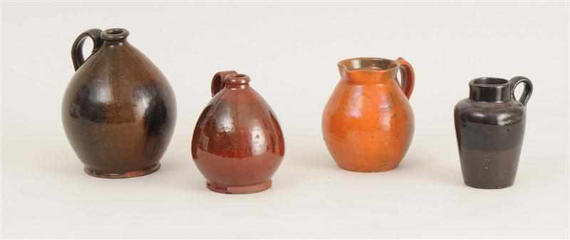 Appraisal: FOUR REDWARE JUGS Comprising three ovoid form and the last