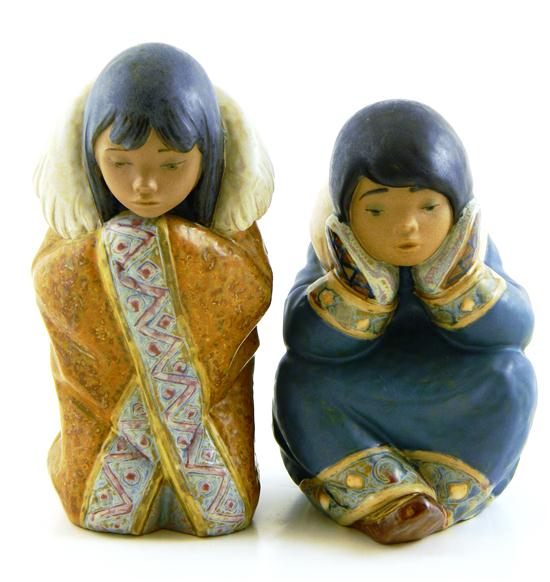 Appraisal: Two Lladro Eskimo figurines by sculptor Francisco Catal Pensive Eskimo