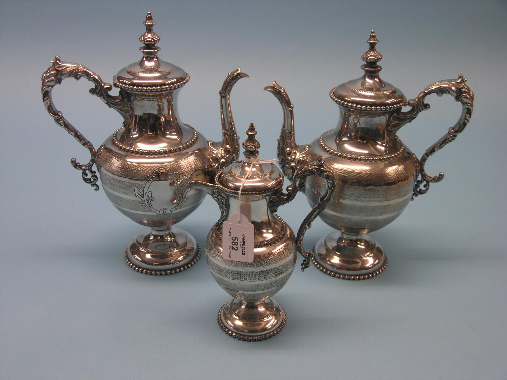 Appraisal: A pair of American silver plated coffee pots with cast