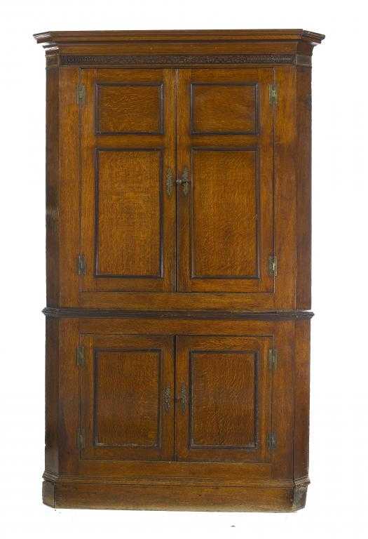 Appraisal: A GEORGE III OAK CORNER CUPBOARD with cavetto cornice and