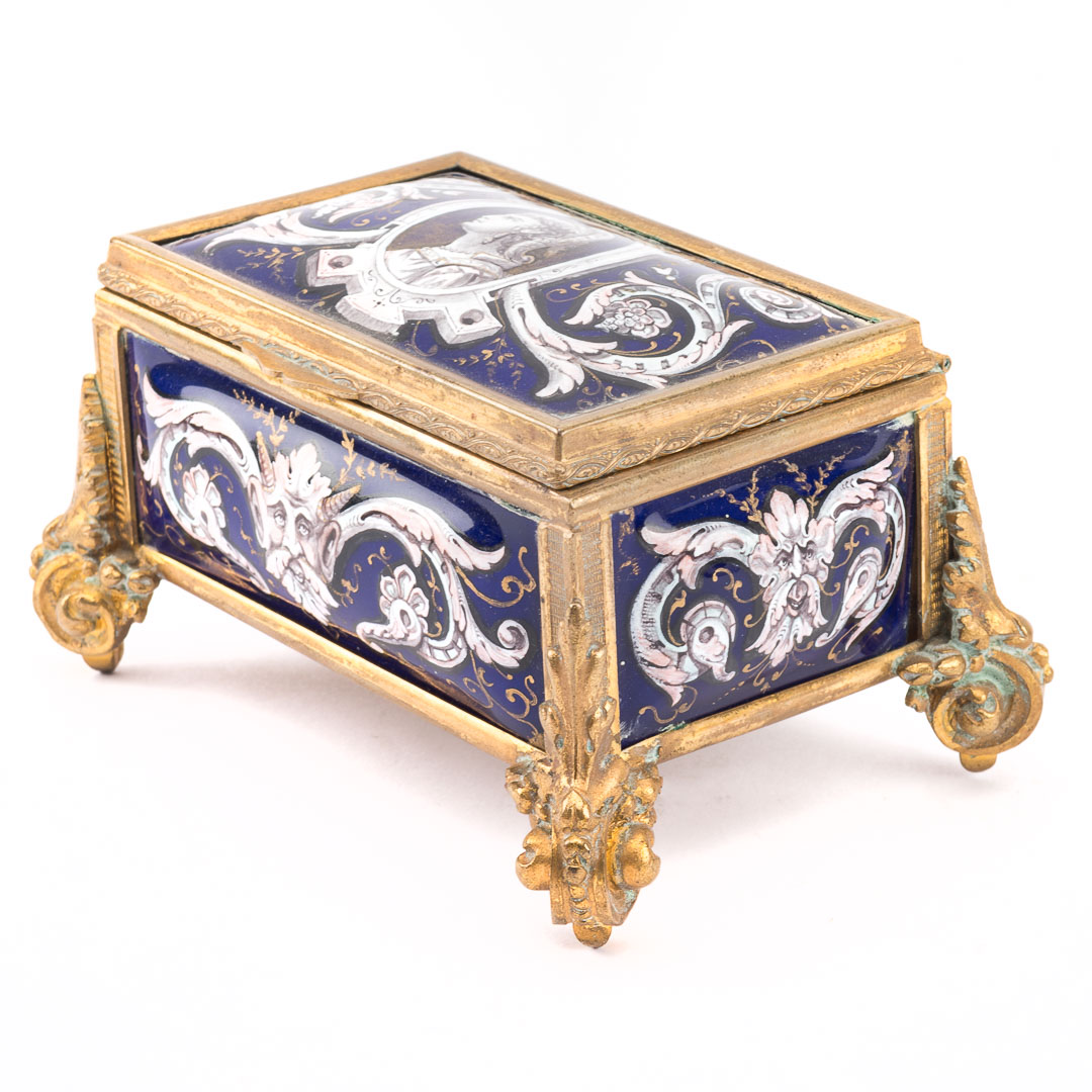 Appraisal: Limoges enamel box th century casket form scrolling bronze-dore mount