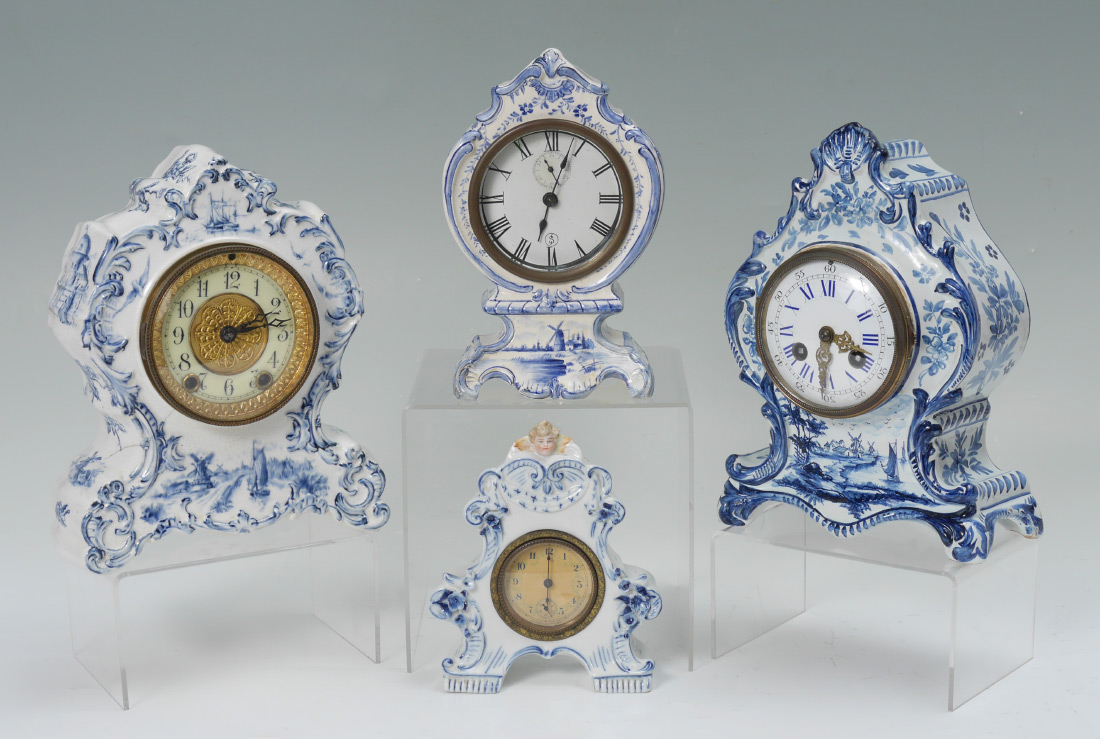 Appraisal: DELFT STYLE PORCELAIN CASE MANTLE CLOCKS An assembled collection of