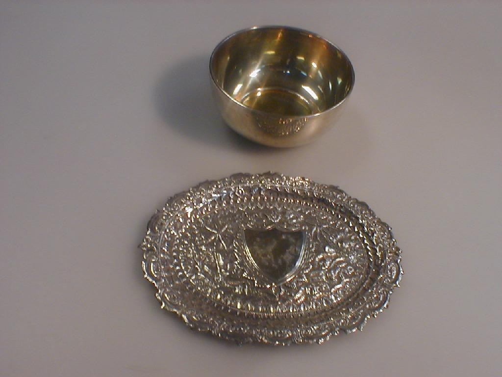 Appraisal: A circular silver bowl with gilt interior and an Indian