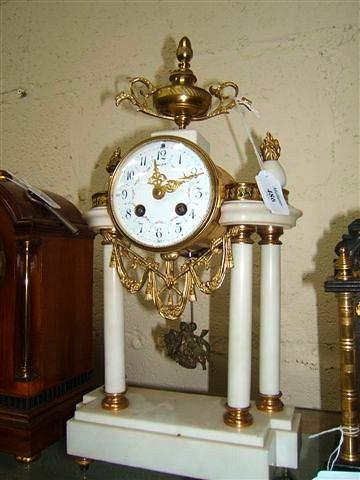 Appraisal: A French white marble and gilt metal mounted mantel clock