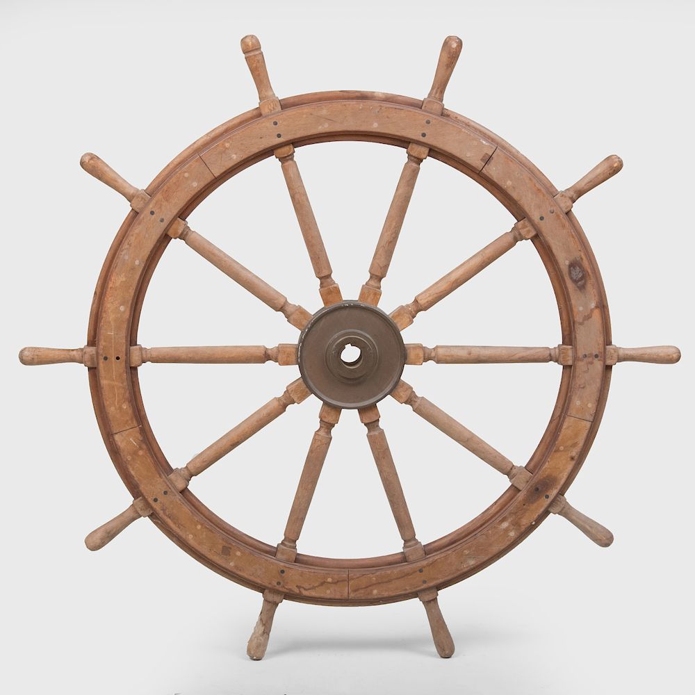 Appraisal: Large Wooden Ship's Wheel Fitted with a brass hub in