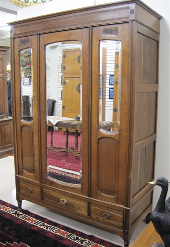 Appraisal: THREE-DOOR OAK WARDROBE Belgian c having one wide and two