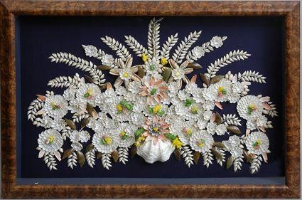 Appraisal: SHELLWORK PICTURE CONTAINED IN SHADOW BOX FRAME The black velvet