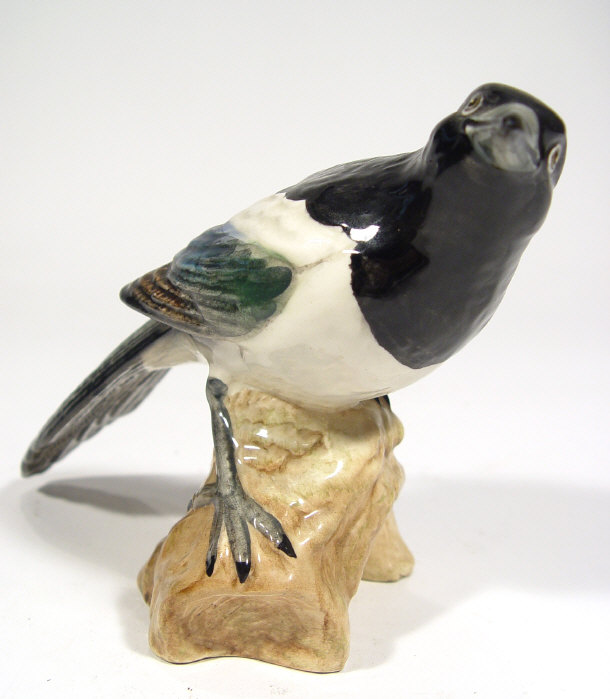 Appraisal: Beswick bird seated on a log factory marks and numbered