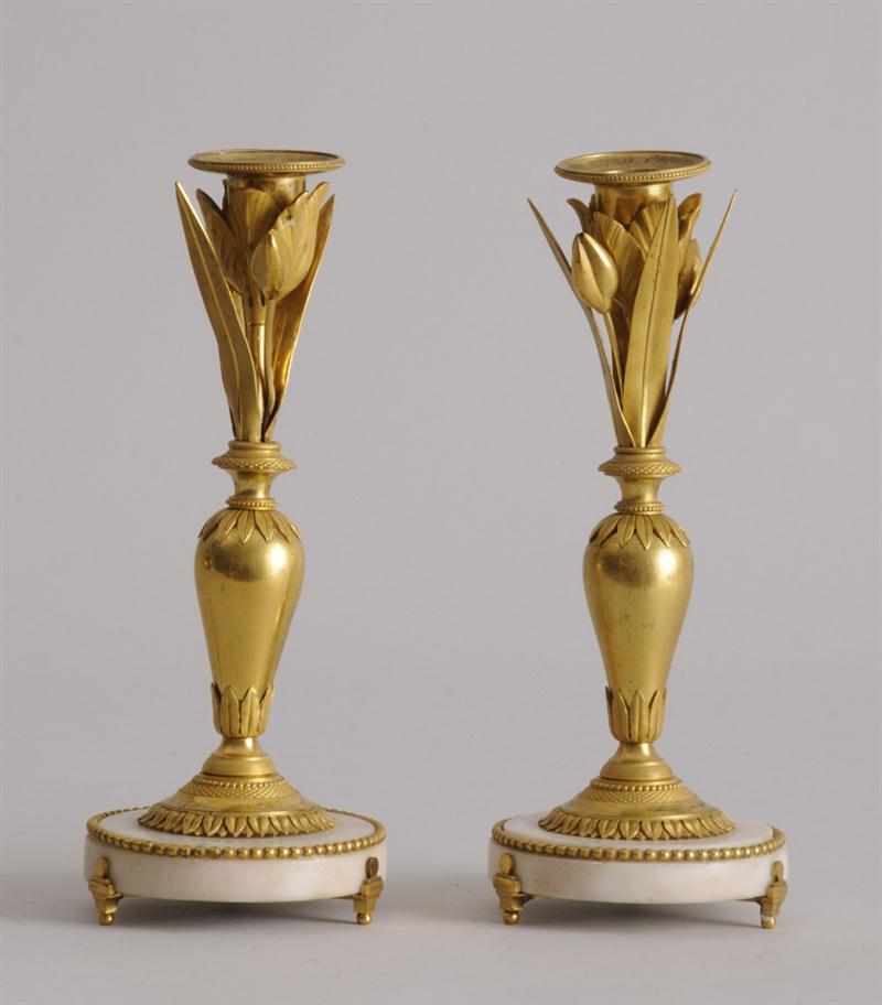 Appraisal: PAIR OF CONTINENTAL NEOCLASSICAL ORMOLU AND MARBLE CANDLESTICKS POSSIBLY RUSSIAN