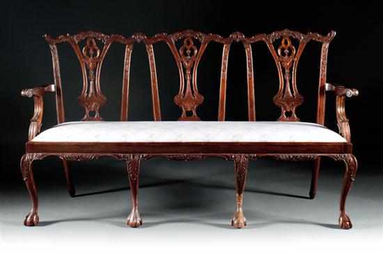 Appraisal: Chippendale style mahogany upholstered triple chair-back settee th century with