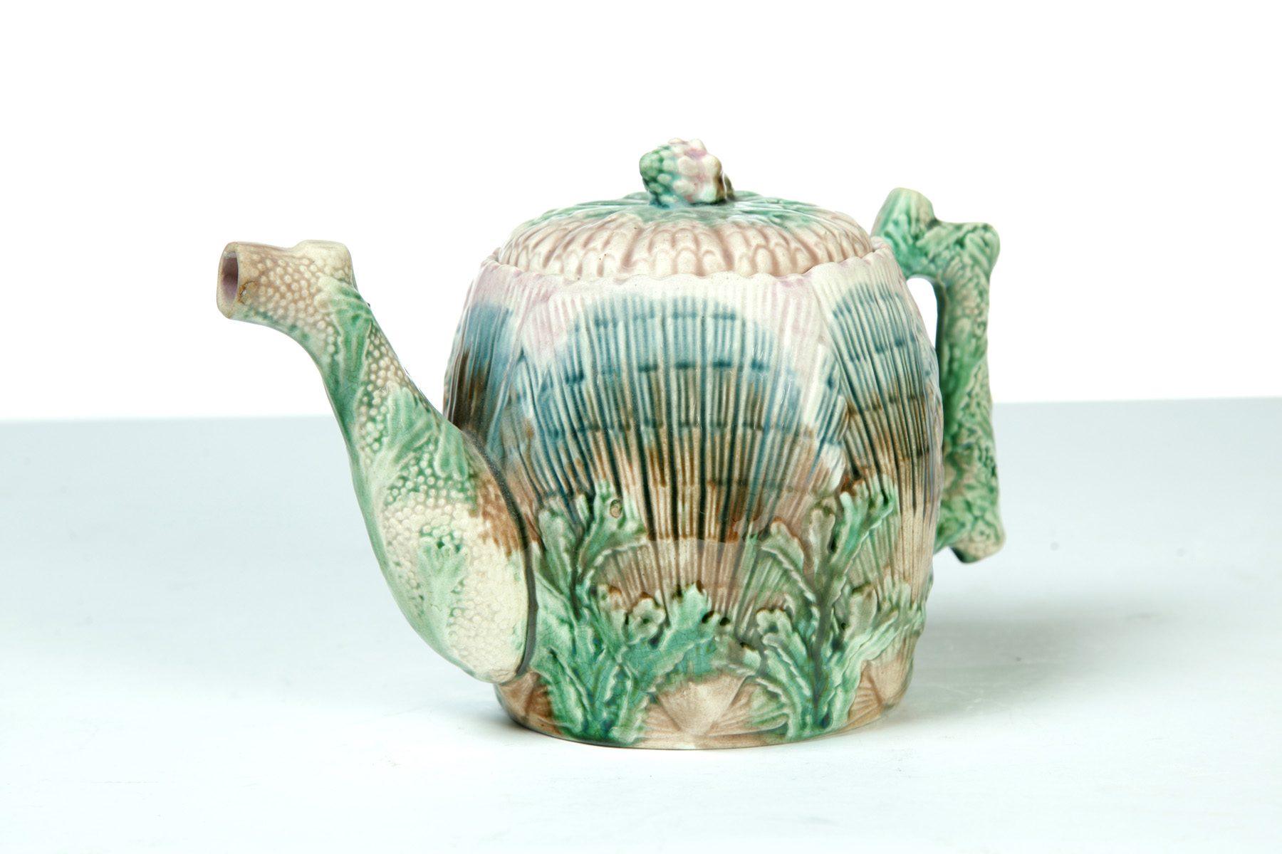 Appraisal: MAJOLICA TEAPOT England nd half- th century Shell design with