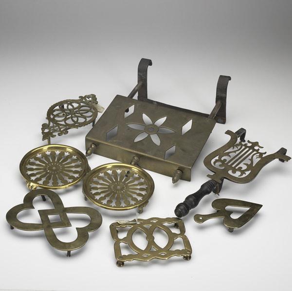 Appraisal: EIGHT BRASS TRIVETS In various sizes and forms all th