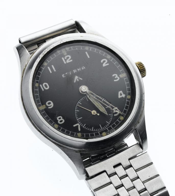 Appraisal: AN ETERNA STAINLESS STEEL MILITARY-ISSUE WRISTWATCH with black dial subsidiary