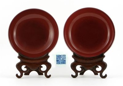 Appraisal: A pair of Chinese sang de boeuf glazed saucer dishes