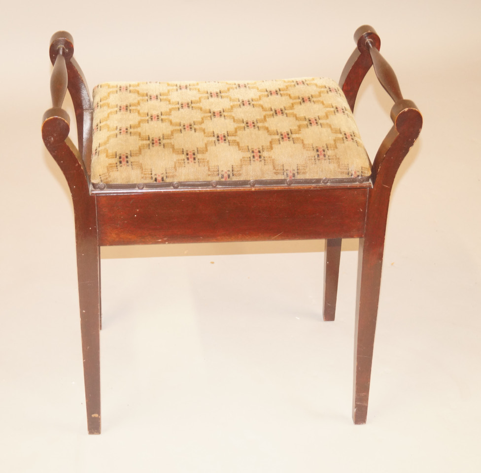 Appraisal: An Edwardian mahogany music stool with a padded seat on