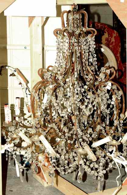 Appraisal: A ROCOCO STYLE TWELVE LIGHT HANGING CHANDELIER the scrolling arms