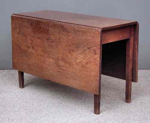 Appraisal: An th Century mahogany dropleaf cottage dining table on square