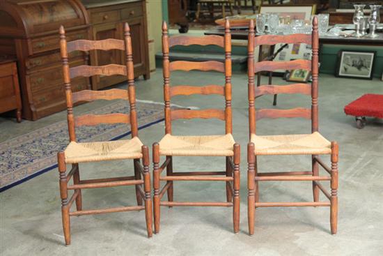 Appraisal: SIX SIDECHAIRS Oak ladderback chairs with turned posts and rush