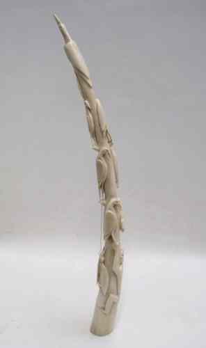 Appraisal: AFRICAN CARVED IVORY TUSK having red-billed hornbills in tree with