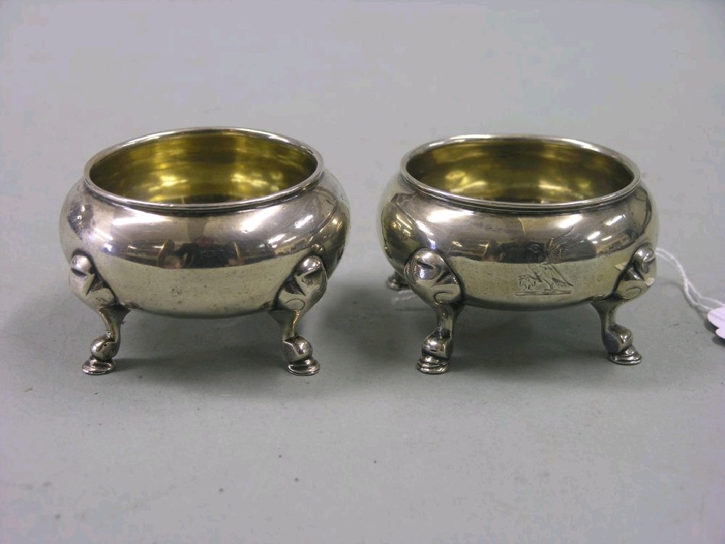 Appraisal: A matched pair of silver salts circular shape with scroll