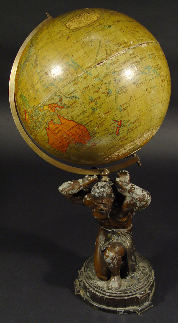 Appraisal: Geographical ten inch terrestrial globe supported by a spelter figure