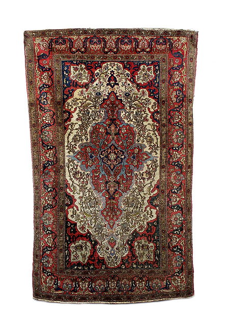 Appraisal: A Persian rug with central foliate design and triple decorated