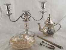 Appraisal: Silver plate A three branch candelabrum a teapot a dish