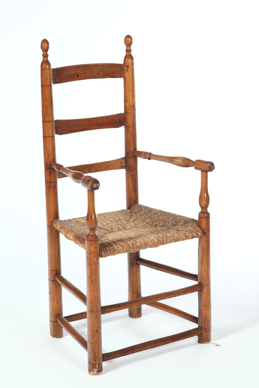 Appraisal: CHILD'S LADDER BACK ARMCHAIR American early th century mixed woods