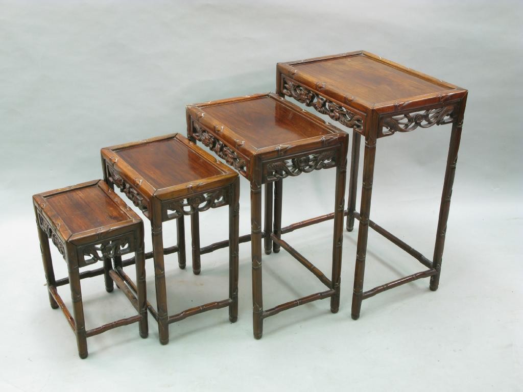 Appraisal: A Chinese quartetto of hardwood tables each with carved and