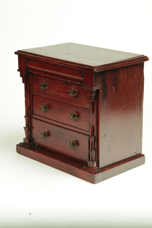 Appraisal: MINIATURE CHEST OF DRAWERS American th century pine Lift-lid compartment