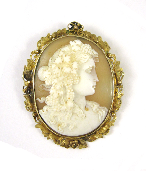 Appraisal: PORTRAIT CAMEO AND FOURTEEN KARAT GOLD BROOCH featuring a hand