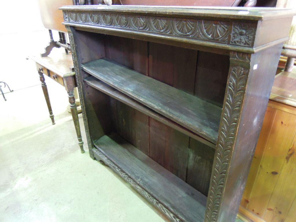 Appraisal: A Victorian dark stained oak freestanding open bookcase with carved