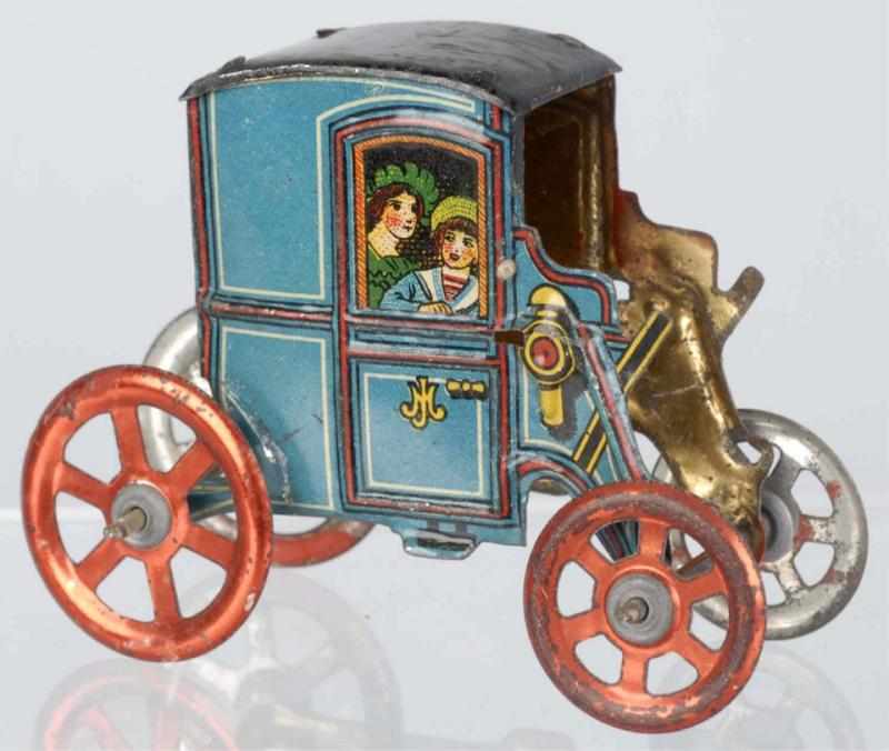 Appraisal: Tin Litho Automobile Penny Toy German Lithographed passengers in windows