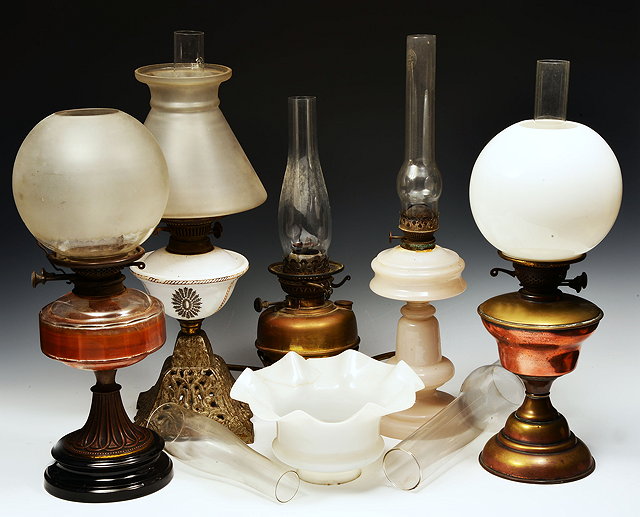 Appraisal: A GROUP OF FIVE VICTORIAN AND LATER OIL LAMPS varying