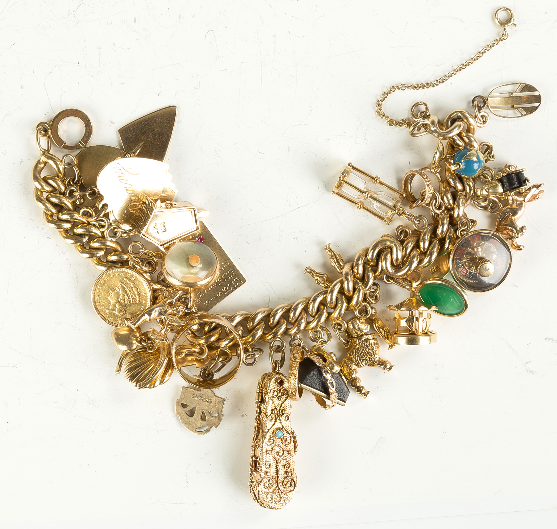 Appraisal: Gold Charm Bracelet Many charms including violin in case