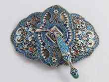 Appraisal: A Russian silver cloisonne enamelled belt buckle fixed by a