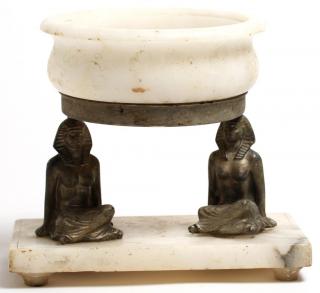 Appraisal: The squared alabaster base with two seated Egyptian females supporting