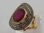 Appraisal: A ruby and diamond dress ring the central oval cut