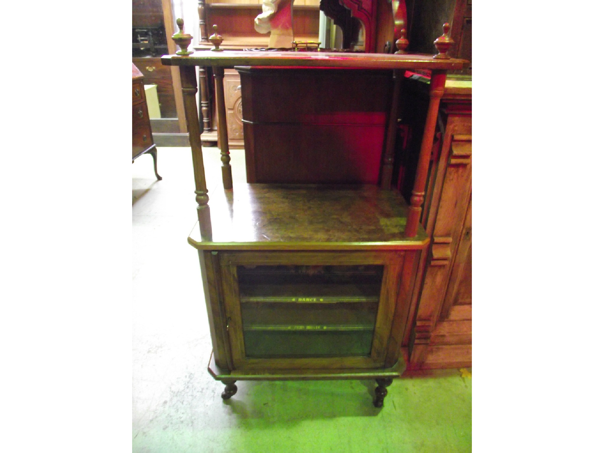 Appraisal: A Victorian walnut and figured walnut veneered music cabinet with