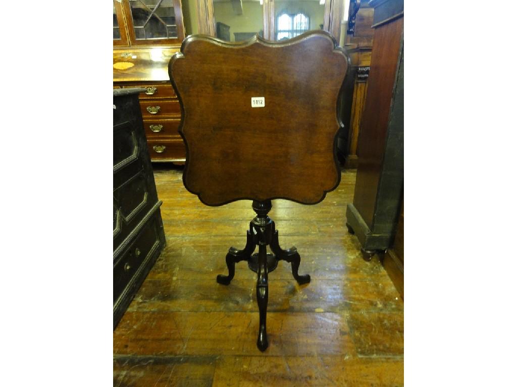 Appraisal: A Georgian mahogany tilt top occasional table with shaped and