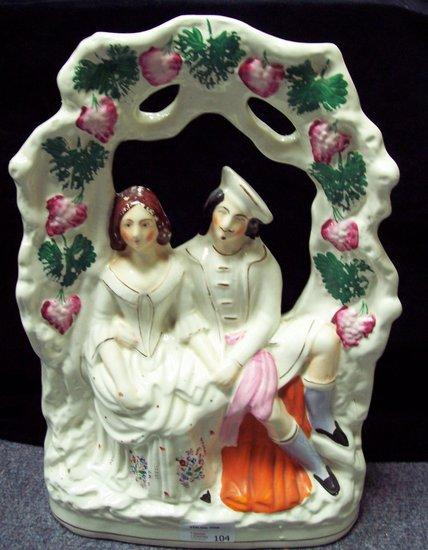 Appraisal: A Staffordshire pottery group of a gallant and his lady