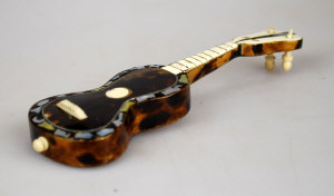 Appraisal: An inlaid tortoiseshell miniature guitar