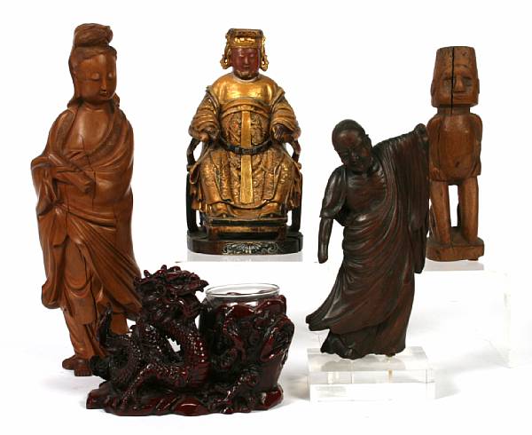 Appraisal: A group of seven Oriental wood and stuccoed wood carved