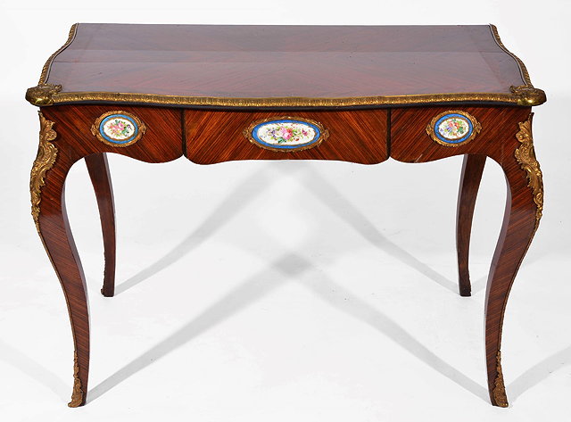 Appraisal: A FRENCH KINGWOOD AND GILT METAL MOUNTED SERPENTINE WRITING DESK