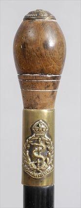 Appraisal: ROYAL ARMY MEDICAL CORPS WALKING STICK The ovoid ringed walnut