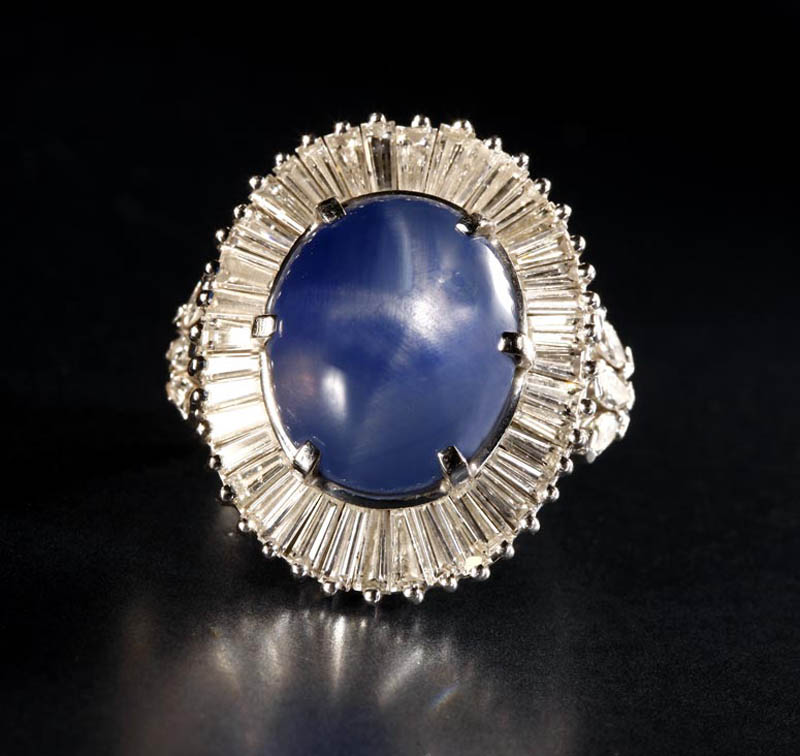 Appraisal: A platinum star sapphire and diamond ring A platinum star